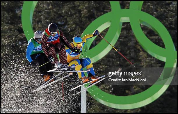 Filip Flisar of Slovenia, Christopher Delbosco of Canada and Tommy Eliasson of Sweden compete in a men's ski cross race on day ten of the Vancouver...