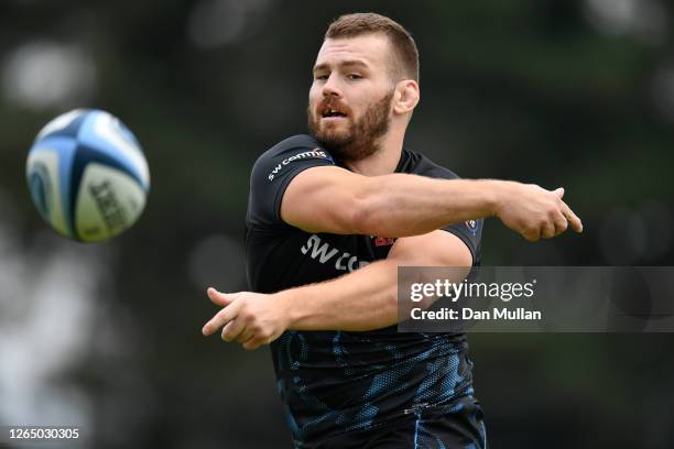 Luke Cowan-Dickie of Exeter Chiefs releases a pass during a training session ahead of the return of Premiership Rugby at Sandy Park on August 10,...