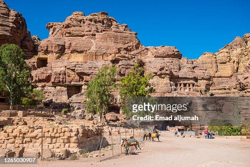 The Tourists Exploring the Qasr al-Bint at the foot of Jabal al-Habis, Petra, Jordan