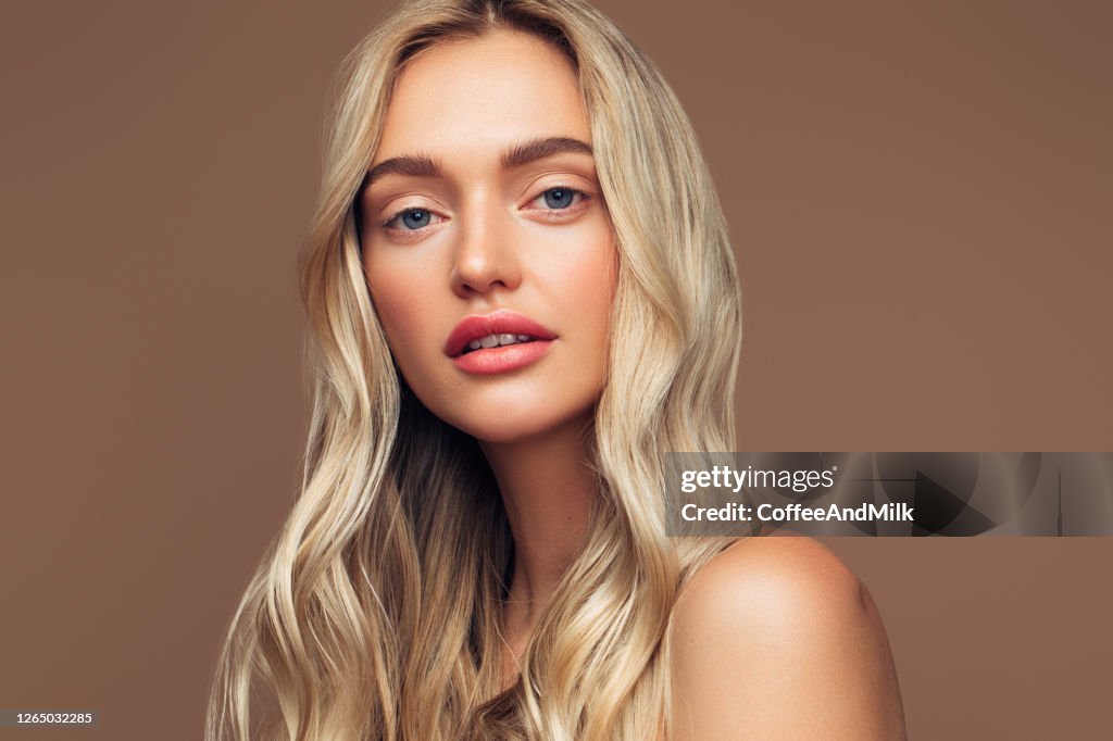 Portrait of young girl with clean skin and soft makeup