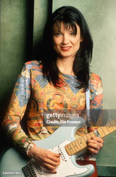 Studio portrait of Meredith Brooks posing with Fender Stratocaster guitar, SAS Hotel, Brussels, Belgium, 14 November 1997.