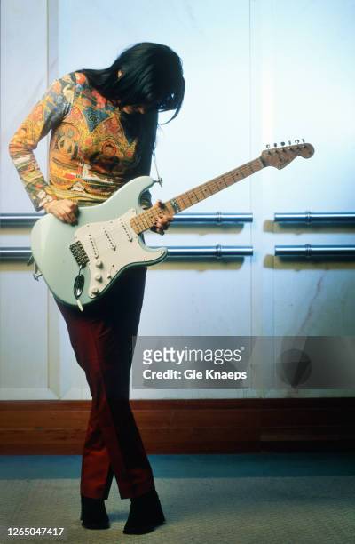 Studio portrait of Meredith Brooks posing with Fender Stratocaster guitar, SAS Hotel, Brussels, Belgium, 14 November 1997.