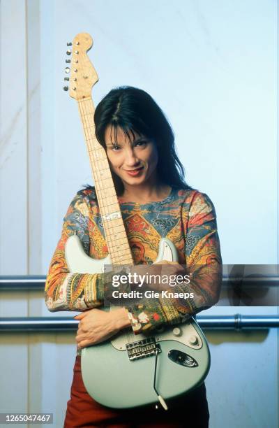 Studio portrait of Meredith Brooks posing with Fender Stratocaster guitar, SAS Hotel, Brussels, Belgium, 14 November 1997.