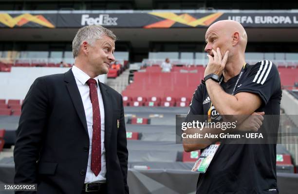 Ole Gunnar Solskjaer, Manager of Manchester United and Stale Solbakken, Manager of FC Kobenhavn talk prior to the UEFA Europa League Quarter Final...