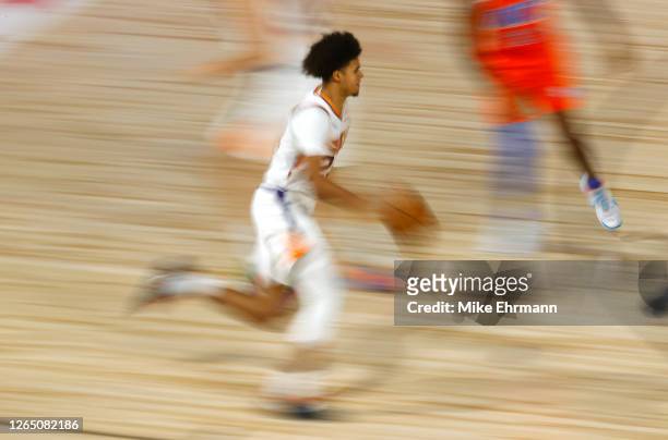 Cameron Johnson of the Phoenix Suns moves the ball up court against the Oklahoma City Thunder during the third quarter at The Field House at ESPN...