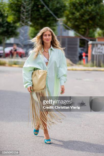 Emili Sindlev is seen wearing green dress, beige bag with fringes outside Mark Kenly during Copenhagen Fashion Week SS21 on August 10, 2020 in...