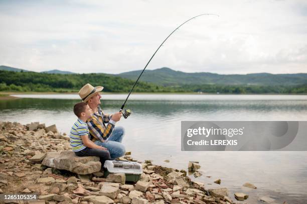Kid Catching Big Fish Photos and Premium High Res Pictures - Getty Images