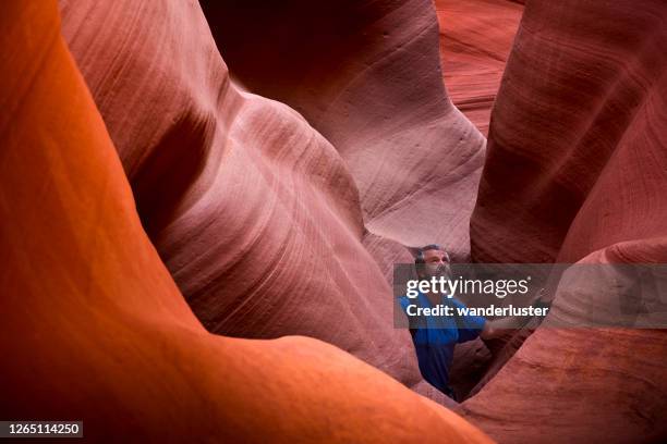 exploring slot canyons in arizona - slot canyon stock pictures, royalty-free photos & images