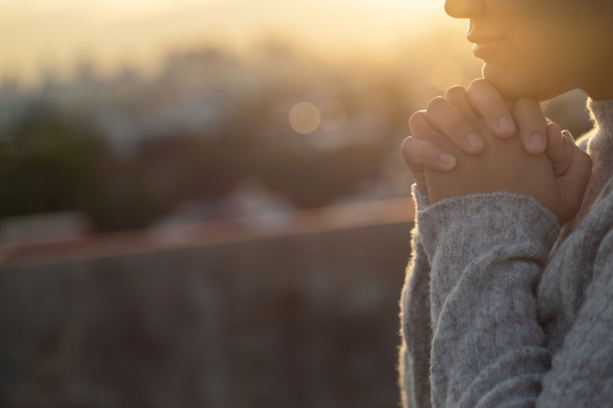 Women raise their hands to ask for blessing from God. Women raise their hands to ask for blessing from God.