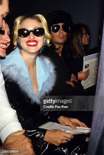 Madonna and Steven Meisel attend a Gianni Versace Show during A Paris Fashion Weeks in the 1990s in Paris, France.