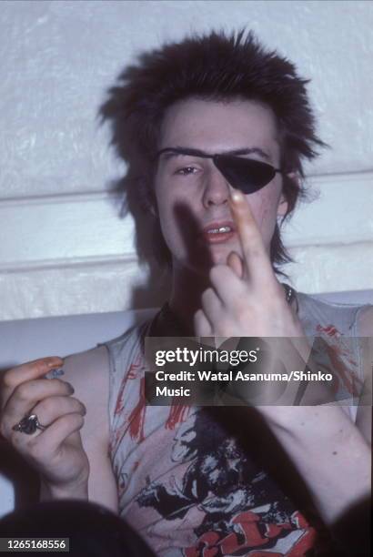 Sid Vicious of the Sex Pistols, wearing an eye patch, at his flat in London, UK, 4th August 1978.