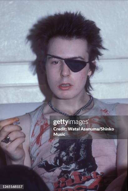 Sid Vicious of the Sex Pistols, wearing an eye patch, at his flat in London, UK, 4th August 1978.