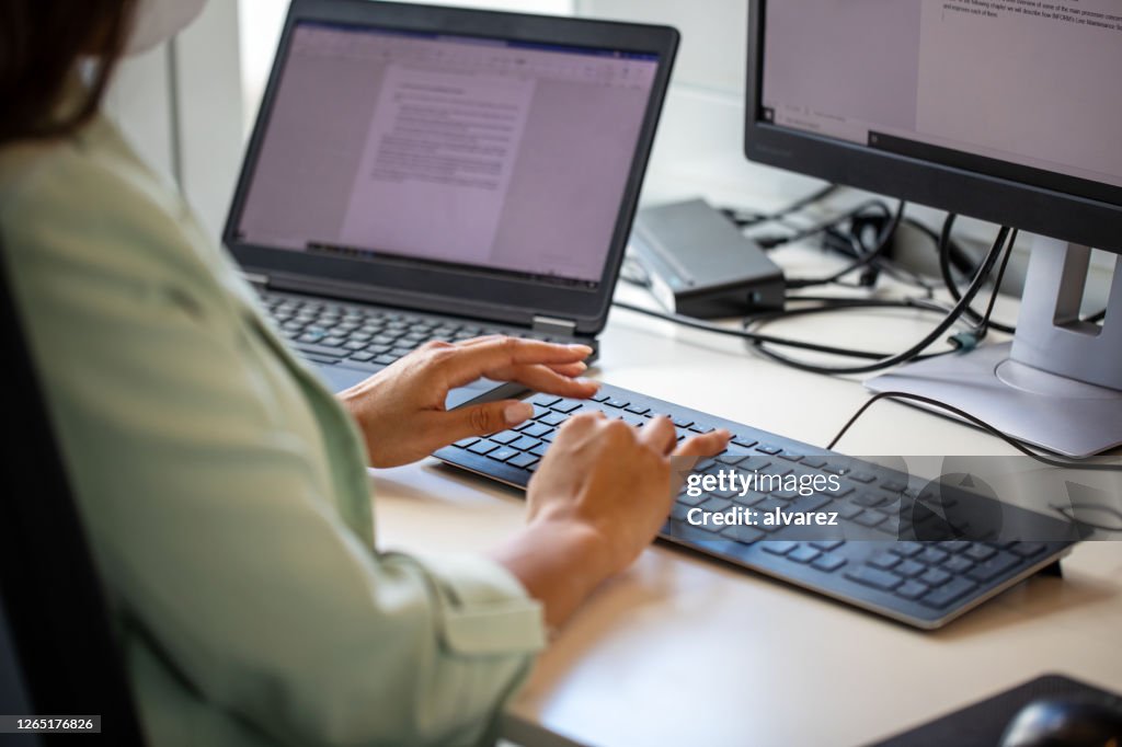 Close-up of a businesswoman using computer