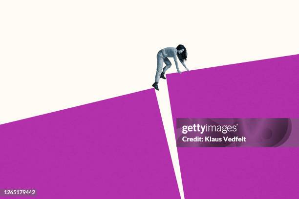 young woman climbing on large magenta blocks - transition collage stockfoto's en -beelden