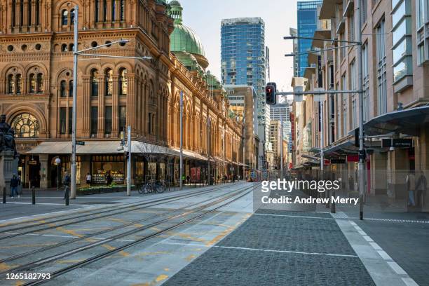 empty city street and shops, coronavirus pandemic, sydney, australia - sydney australia photos et images de collection