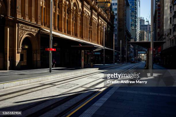 empty city, light rail station platform during coronavirus pandemic, australia - empty city coronavirus fotografías e imágenes de stock