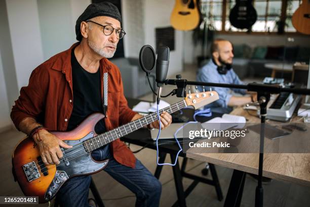 two musicians making song in home office studio - músico de rock imagens e fotografias de stock