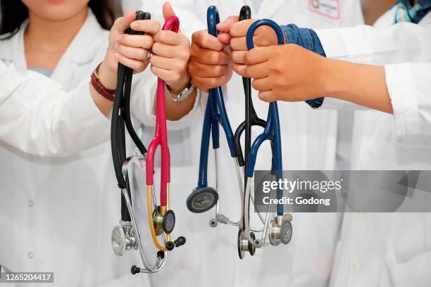 Doctors with stethoscope. Cardiology. Ho Chi Minh City. Vietnam.