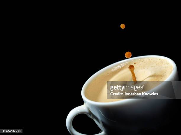 coffee splashing - coffee splash stock-fotos und bilder