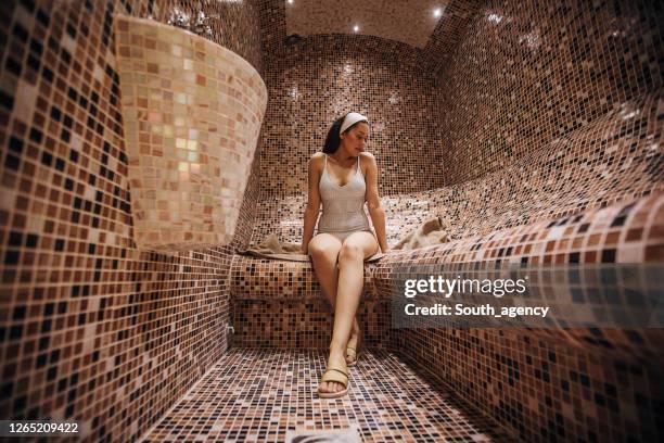 one beautiful woman relaxing in the steam room - turkish bath stock pictures, royalty-free photos & images