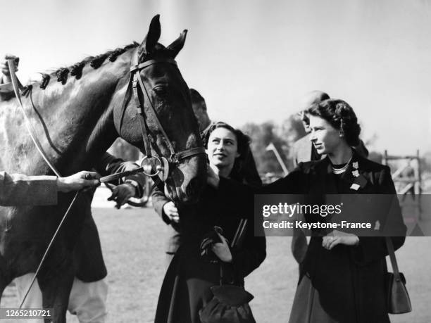 Queen Elizabeth and sister Princess Margaret at Badminton Olympic Horse trials on April 26, 1952 in United Kingdom.