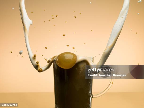 coffee splashing - milk stream stock pictures, royalty-free photos & images