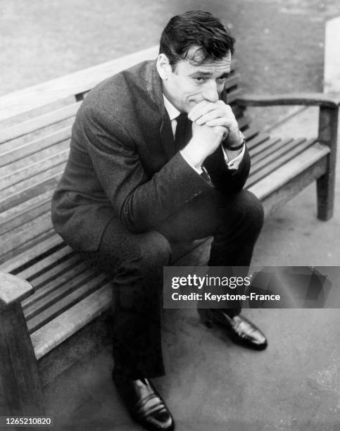 Yves MONTAND seated on a bench in the Embankment Garden of London, where he was to present his one-man show, entitled AN EVENING WITH YVES MONTAND,...