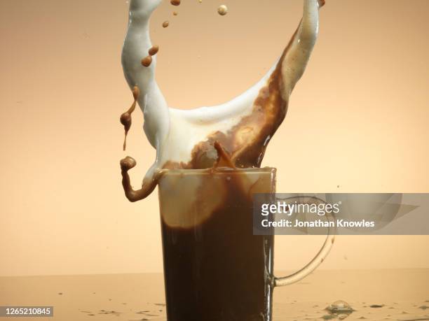 coffee splash - spray foam stock pictures, royalty-free photos & images