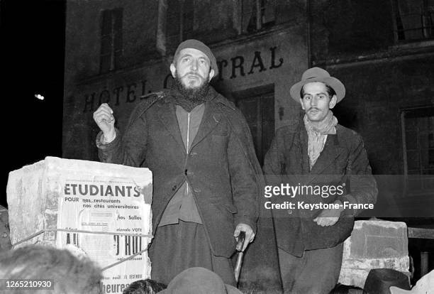 Abbe PIERRE giving a conference before homeless people, mainly students, in Paris in January 1954.