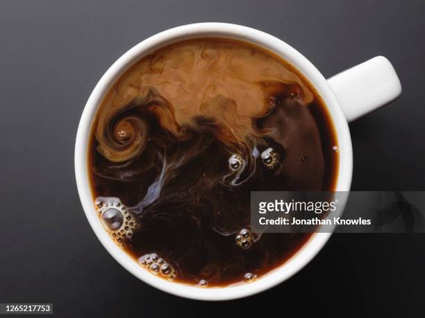 coffee with cream - milk swirl stock pictures, royalty-free photos & images