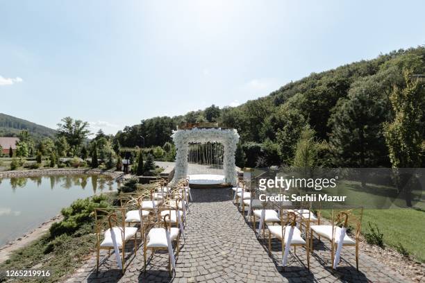 white arch for wedding - stock photo - wedding ceremony stock pictures, royalty-free photos & images
