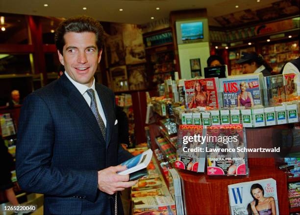 John F. Kennedy Junior at the opening of Hudson News today in Grand Central Station. It was opened by Robert Cohen and his family, including Claudia...