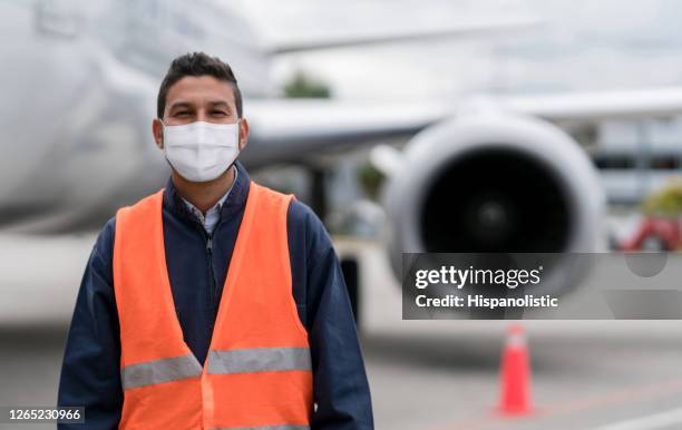 ground technician working at the airport wearing a facemask - air traffic control operator stock pictures, royalty-free photos & images