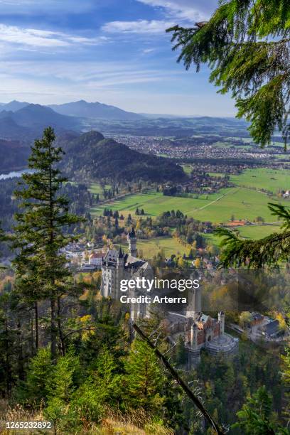 Neuschwanstein Castle in autumn / fall, 19th-century Romanesque Revival palace at Hohenschwangau, Bavaria, Germany.