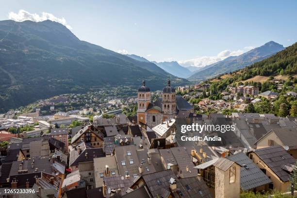 Briancon : rooftop view of the old town and the Parish Church of Notre-Dame-et-Saint-Nicolas, building registered as a National Historic Landmark .