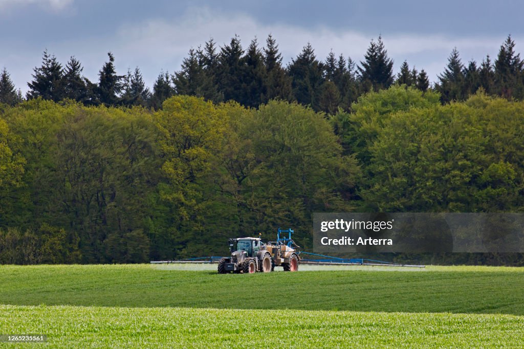 Forester Insecticide Farmer spraying pesticides / insecticides / weed killer / herbicide ...