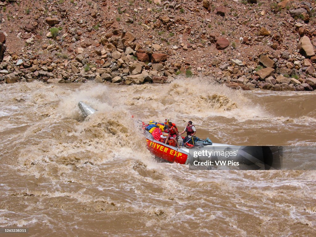 A 33' S-rig raft takes a big hit in Big Drop II, a CLass IV rapid, in Cataract Canyon at high water.