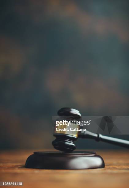 gavel on desk - auction table stock pictures, royalty-free photos & images