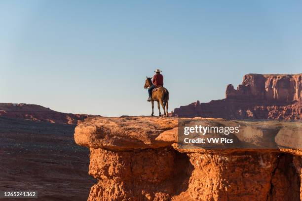 Cowboy silhouette at John Ford's point, Monument Valley, USA.
