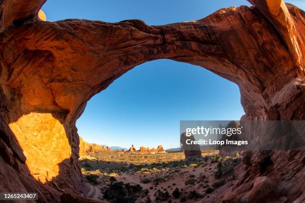 The view through Double Arch in Arches National Park near Moab in Utah.