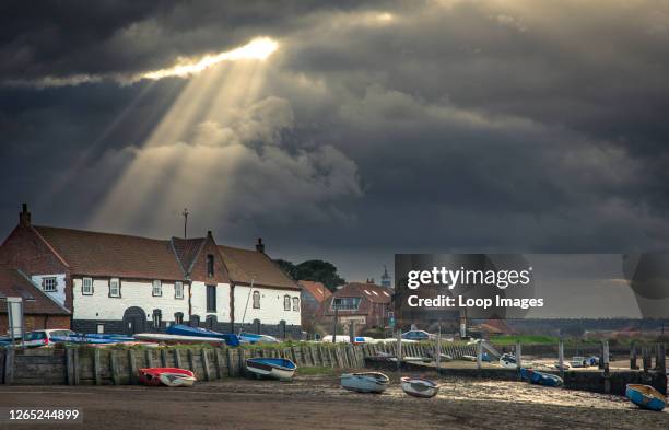 God beams or crepuscular rays at Burnham Overy Staithe.