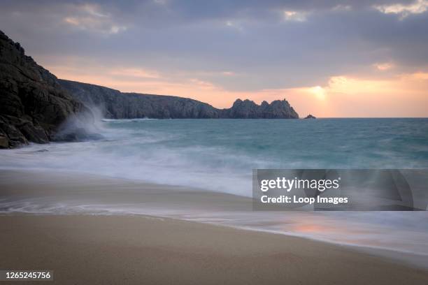 Porthcurno Beach at sunrise in West Cornwall.