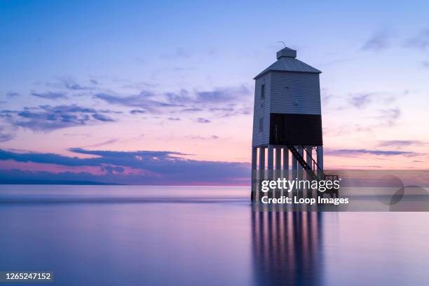 The Low Lighthouse on the beach at Burnham-on-Sea overlooking Bridgwater Bay at dusk.