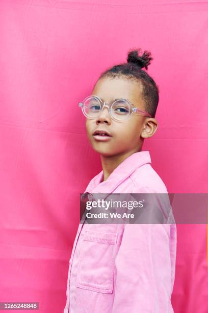 portrait of fashionable boy on pink background - kids fashion stock pictures, royalty-free photos & images