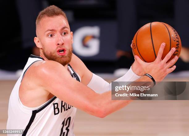 Dzanan Musa of the Brooklyn Nets drive to the basket against the Orlando Magic during the first half at AdventHealth Arena at ESPN Wide World Of...