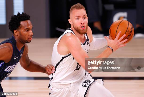 Dzanan Musa of the Brooklyn Nets drive to the basket against the Orlando Magic during the first half at AdventHealth Arena at ESPN Wide World Of...