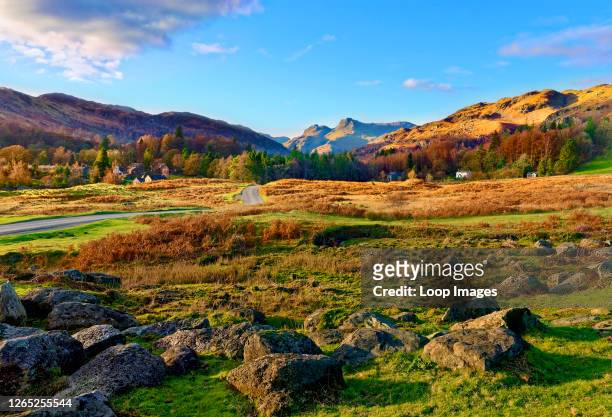 Sunny autumn view of Elterwater Village in the Langdale Valley in the English Lake District.