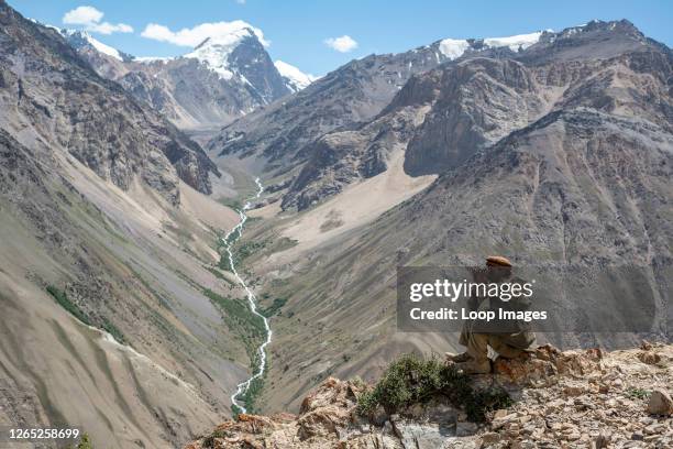 Wakhi man looks out to the mountains in the Wakhan Corridor of Afghanistan.