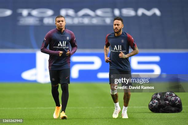 Neymar and Kylian Mbappe of PSG look on during the PSG Training Session ahead of the UEFA Champions League Quarter Final match between Atalanta and...