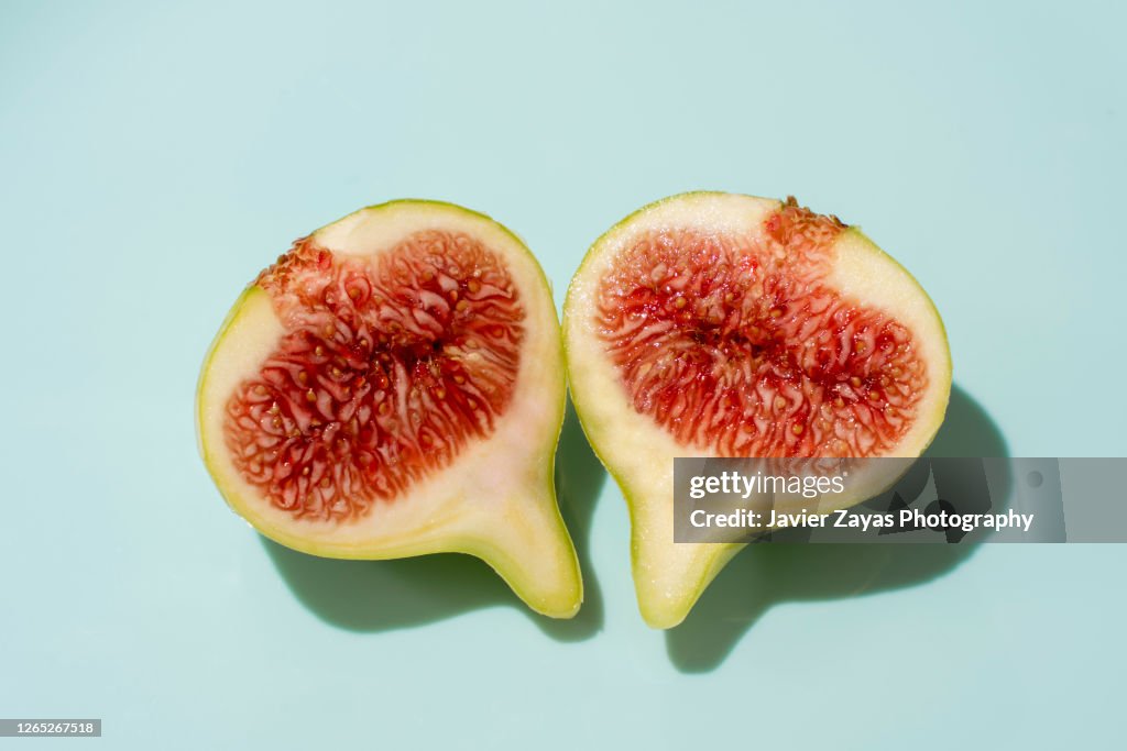 Slices Of Fig On Turquoise Background